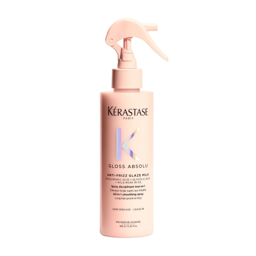 Butelka Kérastase Gloss Absolu Anti-Frizz Glaze Milk na białym tle, podkreślająca minimalistyczny design i opis kluczowych składników produktu.