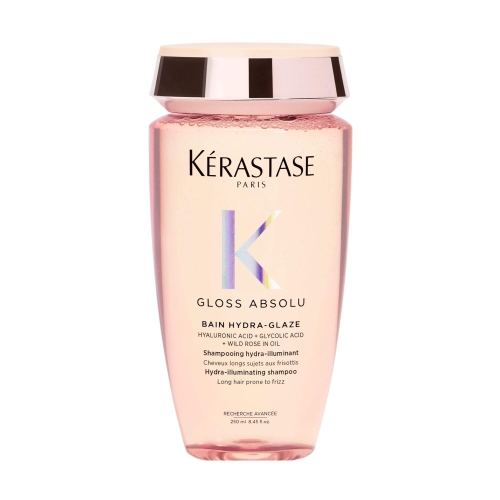 Butelka szamponu Kérastase Gloss Absolu Hydra-Glaze o pojemności 250 ml, różowy transparentny żel zamknięty w eleganckim opakowaniu ze złotą nakrętką.