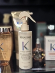 Kérastase Gloss Absolu Anti-Frizz Glaze Milk – spray wygładzający na półce sklepowej