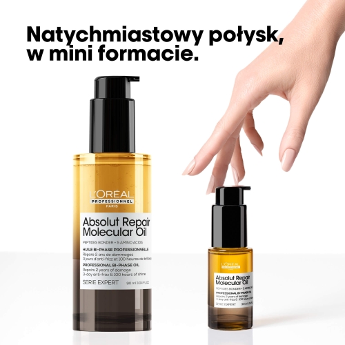Dwufazowy olejek odbudowujący do włosów w wersji 30 ml – mini format Absolut Repair Molecular obok pełnowymiarowej butelki.