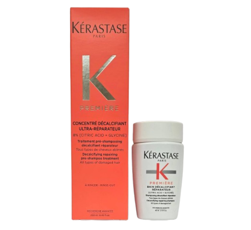 Duży karton koncentratu Kérastase Première 250 ml obok małej butelki kąpieli 80 ml.