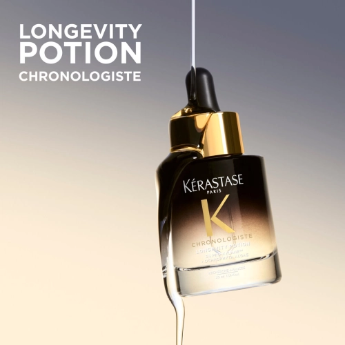 Butelka serum Kérastase Chronologiste Longevity Potion ze złotą nakrętką i czarną pipetą, otoczona strugą płynu; obok nazwa produktu.